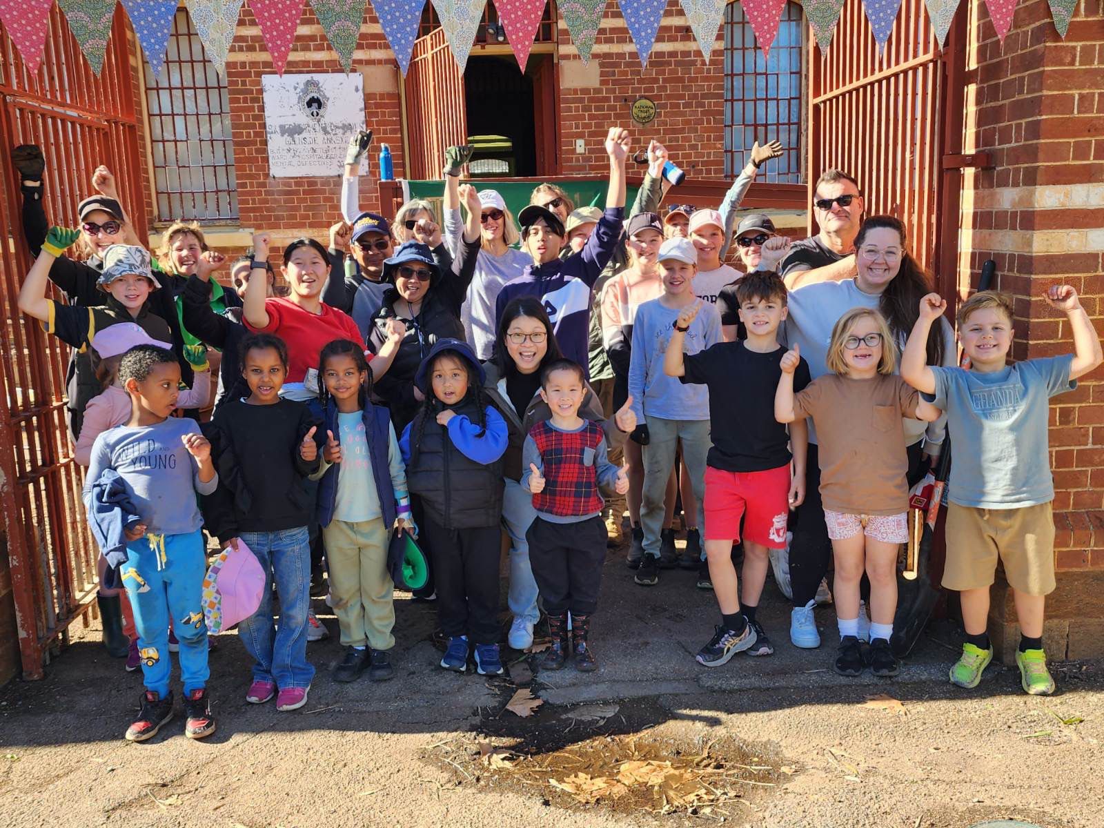 Children and families in front of historic building
