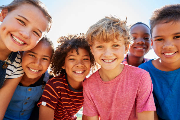 6 children smiling on a sunny day